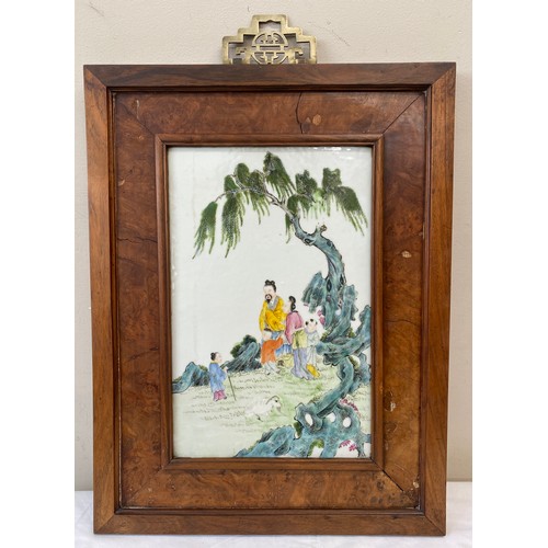 767 - A Chinese ceramic plaque in walnut frame. 38.5 x 20cm plaque size.