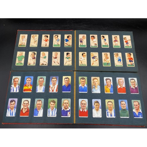 1060 - A large quantity of cigarette cards to include Wills, Player's, famous footballers Carreras, Ogden's... 