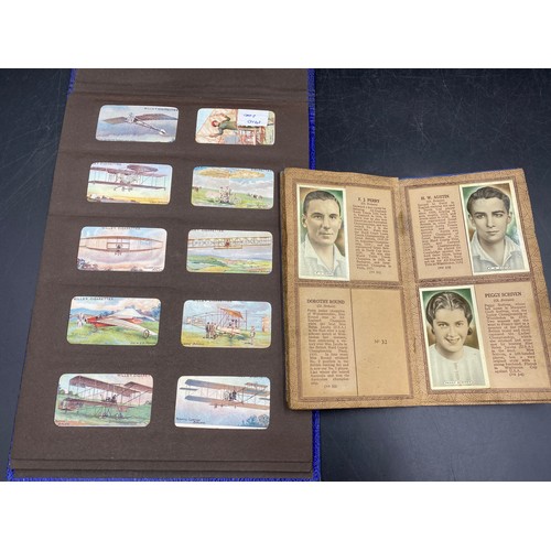 1060 - A large quantity of cigarette cards to include Wills, Player's, famous footballers Carreras, Ogden's... 