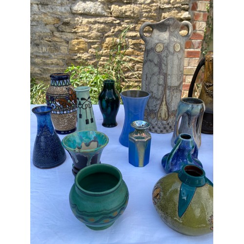 225 - A collection of pottery and studio pottery to include jugs and vases, Carter Stabler Adams Poole etc... 