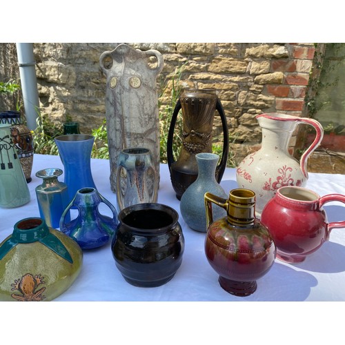 225 - A collection of pottery and studio pottery to include jugs and vases, Carter Stabler Adams Poole etc... 