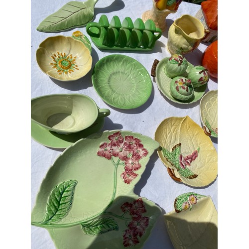 232 - A selection of Carlton ware, various base marks to include dishes, serving spoons, toast rack, lidde... 