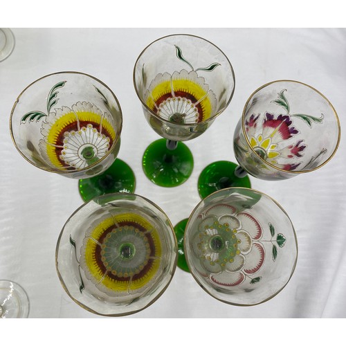 517 - Decorative part set of wine glasses depicting crocus, 4 x 20cm and 6 x 15.5cm, together with 5 other... 