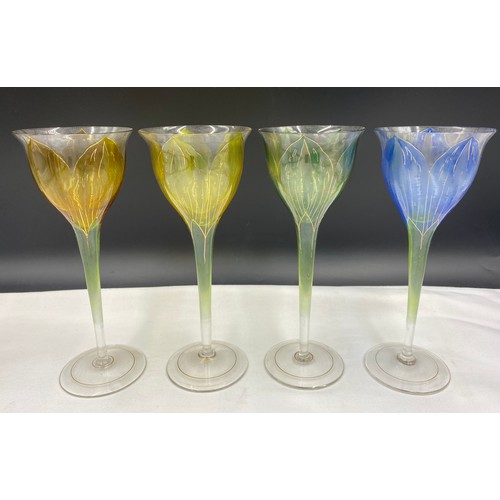 517 - Decorative part set of wine glasses depicting crocus, 4 x 20cm and 6 x 15.5cm, together with 5 other... 