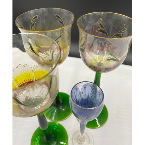 517 - Decorative part set of wine glasses depicting crocus, 4 x 20cm and 6 x 15.5cm, together with 5 other... 