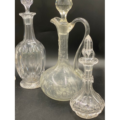 518 - A collection of six decanters various styles and sizes, tallest 32cm, together with a pair of cut gl... 