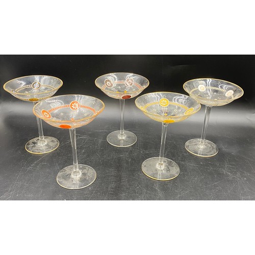 520 - Two champagne flutes 28cm h, five champagne coupes 16cm h, three liqueur glasses etched with classic... 