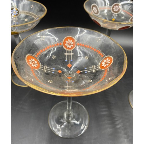 520 - Two champagne flutes 28cm h, five champagne coupes 16cm h, three liqueur glasses etched with classic... 