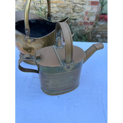 1082 - Three pieces brass to include Art Nouveau trivet 24cm h, coal helmet and lidded jug.