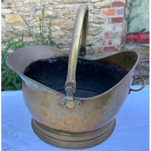 1082 - Three pieces brass to include Art Nouveau trivet 24cm h, coal helmet and lidded jug.