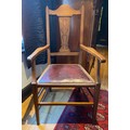 Oak armchair with inlaid panel. Arm to arm 55cm, to back 105cm.