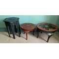 Two circular oriental lacquered and painted tables together with a carved hexagonal occasional table... 