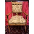 Arts and Crafts satin birch elbow chair inlaid with ebony. 103 h x 60cm w.