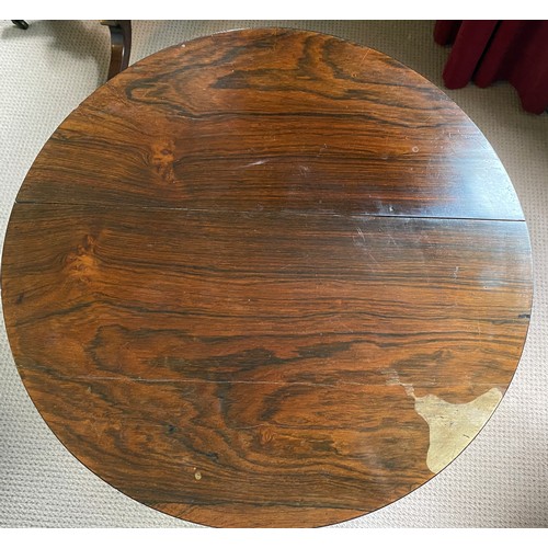 56 - A Regency rosewood circular occasional table. 75 h x 55cm d.
