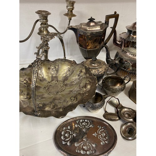 781 - A large quantity of silver plate to include coffee and tea pots, candelabra, etc.