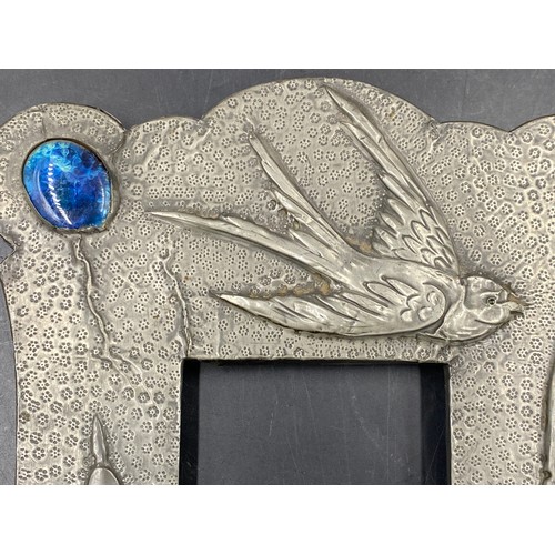 945 - Pewter picture frame set with a blue cabochon to top left,  depicting a bird flying over bulrushes a... 