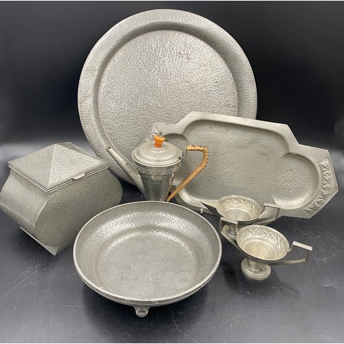 946 - A selection of hammered English pewter to include a Howard bowl on four feet 21cm diameter, Craftsma... 