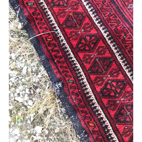 1131 - Oriental runner, predominantly red. 300 l x 80 w.