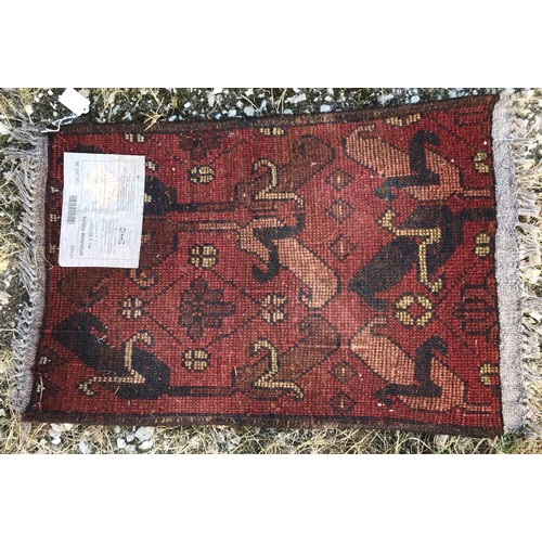 1135 - Three rugs, largest 103 l x 84cm w, second largest 72 l x 52 w and smallest 60 l x 39cm w.