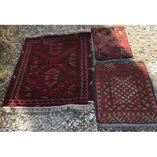 1135 - Three rugs, largest 103 l x 84cm w, second largest 72 l x 52 w and smallest 60 l x 39cm w.