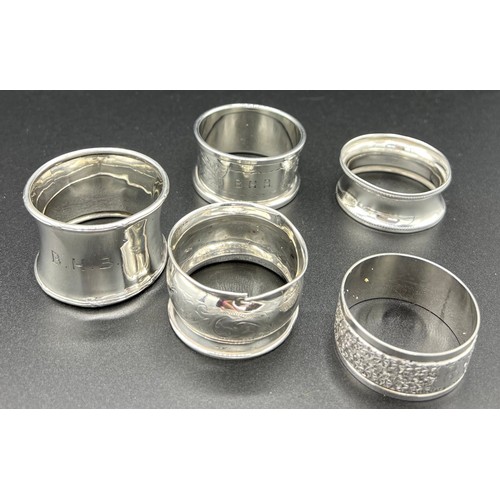 832 - Five silver napkin rings, various dates and makers. 66gm total weight.