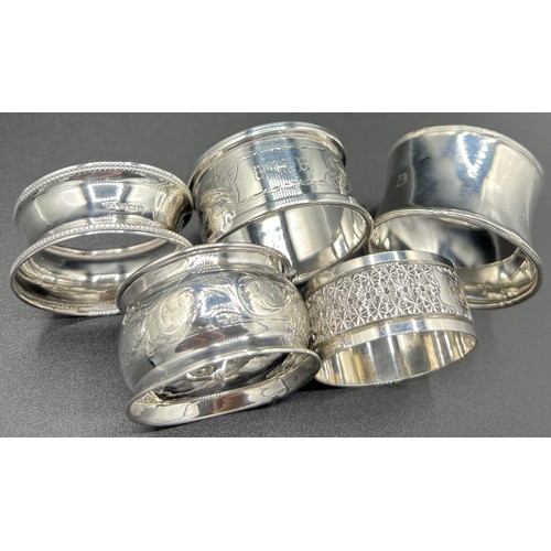 832 - Five silver napkin rings, various dates and makers. 66gm total weight.