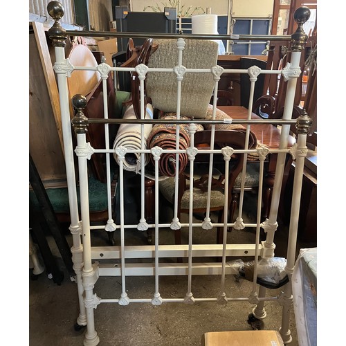 69 - A 19thC 3 ft brass and iron bedstead on castors with side rails.