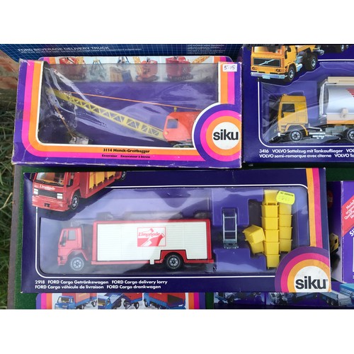 988 - Twelve boxed diecast Siku trucks, crane and mobile home to include Nos. 2914 Kranwagon Mobile Crane,... 