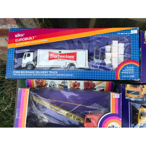 988 - Twelve boxed diecast Siku trucks, crane and mobile home to include Nos. 2914 Kranwagon Mobile Crane,... 