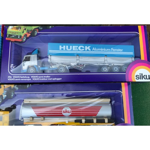 988 - Twelve boxed diecast Siku trucks, crane and mobile home to include Nos. 2914 Kranwagon Mobile Crane,... 