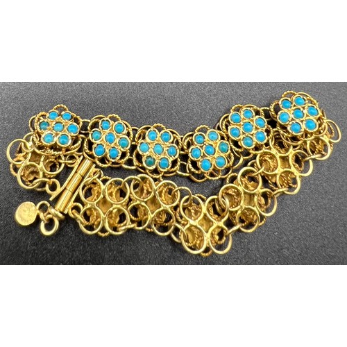 557 - Yellow metal, tests as 22ct gold bracelet set with turquoise, total weight 24.1gm. 18cm.