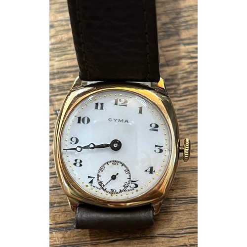 912 - A Cyma gentleman's 9ct gold wristwatch with white enamel face and subsidiary second dial on leather ... 