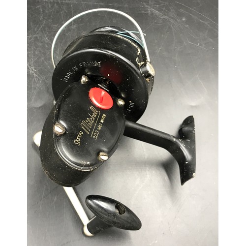 Two fishing reels, one Gilfin model 1100, one Garcia Mitchell 3-0-3 Salt  Water, made in France.