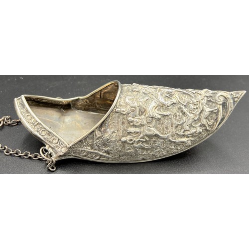 824 - A silver wall pocket in the form of a slipper decorated with hunting scenes. Maker George Nathan and... 