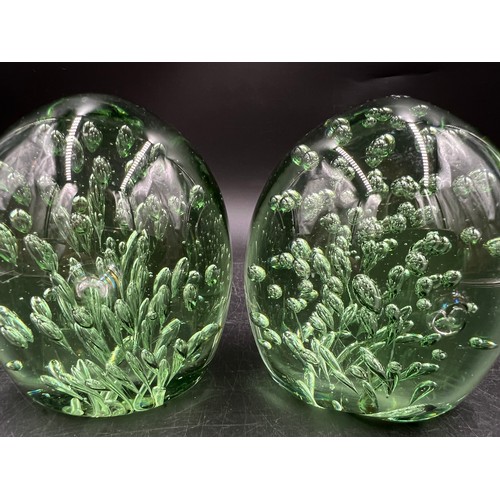 528 - Two 19thC green glass dumps. 11cm h approx.