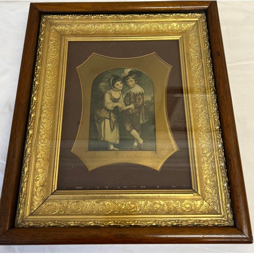 1102 - A 19thC print of two children in a decorative gilt and rosewood frame. 37 x 33cm.