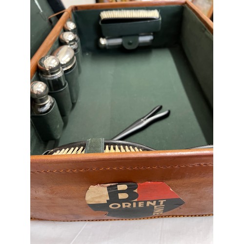 1259 - A gentleman's fitted leather suitcase to include ebony mirror, brushes, glove stretchers, bottles et... 