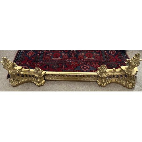 1262 - A 19thC French gilt metal adjustable fender. 111cm fully extended.