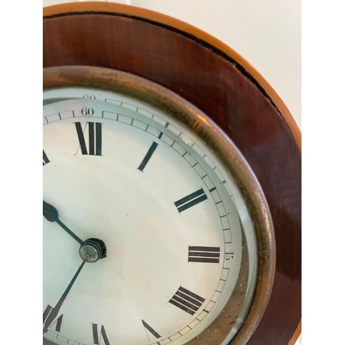 1017 - French mahogany inlaid mantle clock with bun feet and enamel dial with Roman numerals. 23cm h.