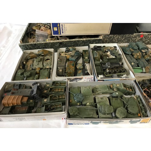 1002 - A very large quantity of Army toys to include model soldiers, tanks (some camouflaged), trucks etc.