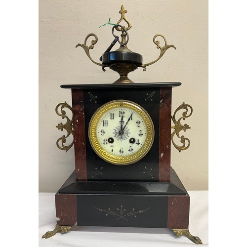 1020 - A 19thC French marble mantle clock on brass paw feet and white enamel dial. 43 x 27cm.