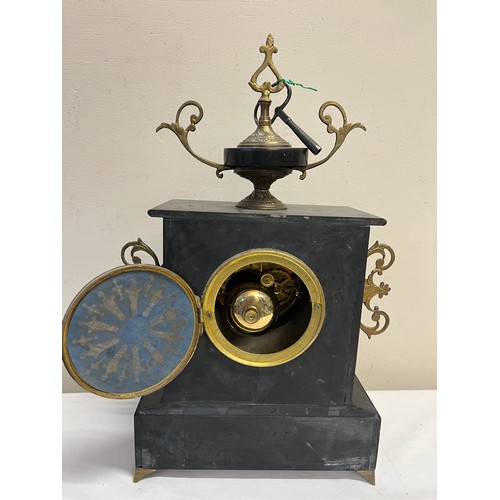 1020 - A 19thC French marble mantle clock on brass paw feet and white enamel dial. 43 x 27cm.