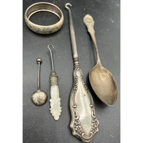 818 - Silver to include spoons, napkin ring, button hook and plated and mother of pearl button hook.