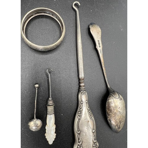 818 - Silver to include spoons, napkin ring, button hook and plated and mother of pearl button hook.