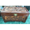 Camphor wood chest with oriental carvings to top and all sides, 100 l x 53 w x 58cm h.