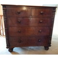 A 19thC mahogany chest of 2 short over 3 long drawers. Columns to sides on bun feet. 108cm w x 49.5c... 