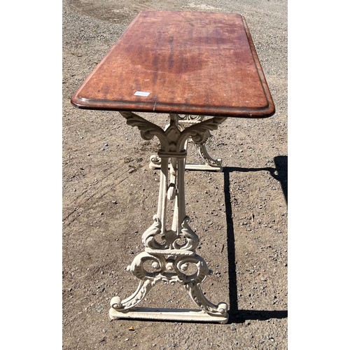 209 - A Victorian pub table, cast iron base with mahogany top.