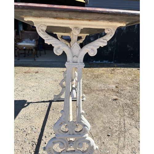 209 - A Victorian pub table, cast iron base with mahogany top.