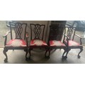 Four early 20thC mahogany dining chairs, 2 carvers and 2 side chairs with ball and claw feet.