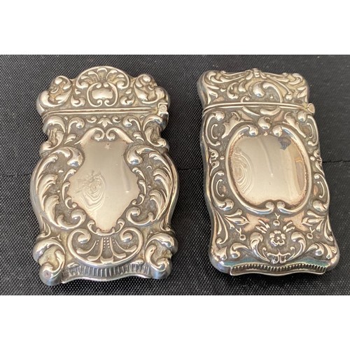 863 - Two silver vesta cases with 'Sterling' stamped to inner opening. 6.5cm h. Total 42gm.